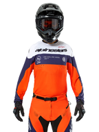 Alpinestars Pro-Dura Jersey, Motocross Jersey, Navy Blue, Hot Orange, and White, worn with a black helmet and gloves, featuring laser-perforated ventilation zones, bold branding, and "ONE GOAL. ONE VISION." chest graphic
