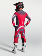 Alpinestars Supertech Hiten AFD, zestaw i koszulka motocrossowa, czerwony fluo i szary, widok z tyłu na modelu