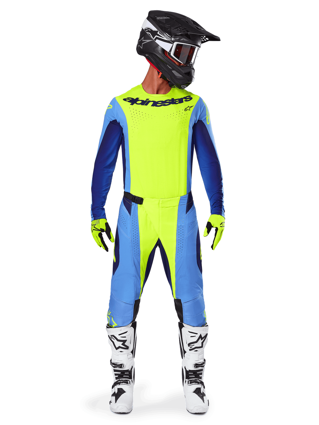 Zawodnik motocrossowy w pełnym stroju wyścigowym, koszulka Alpinestars 2025 Techstar Melt w kolorze żółtym fluo i niebieskim, dopasowane żółto-niebieskie spodnie motocrossowe, czarny kask z białą grafiką i goglami, biało-czarne buty, żółto-czarne rękawice, skoordynowany zestaw wyczynowy do wyścigów off-road