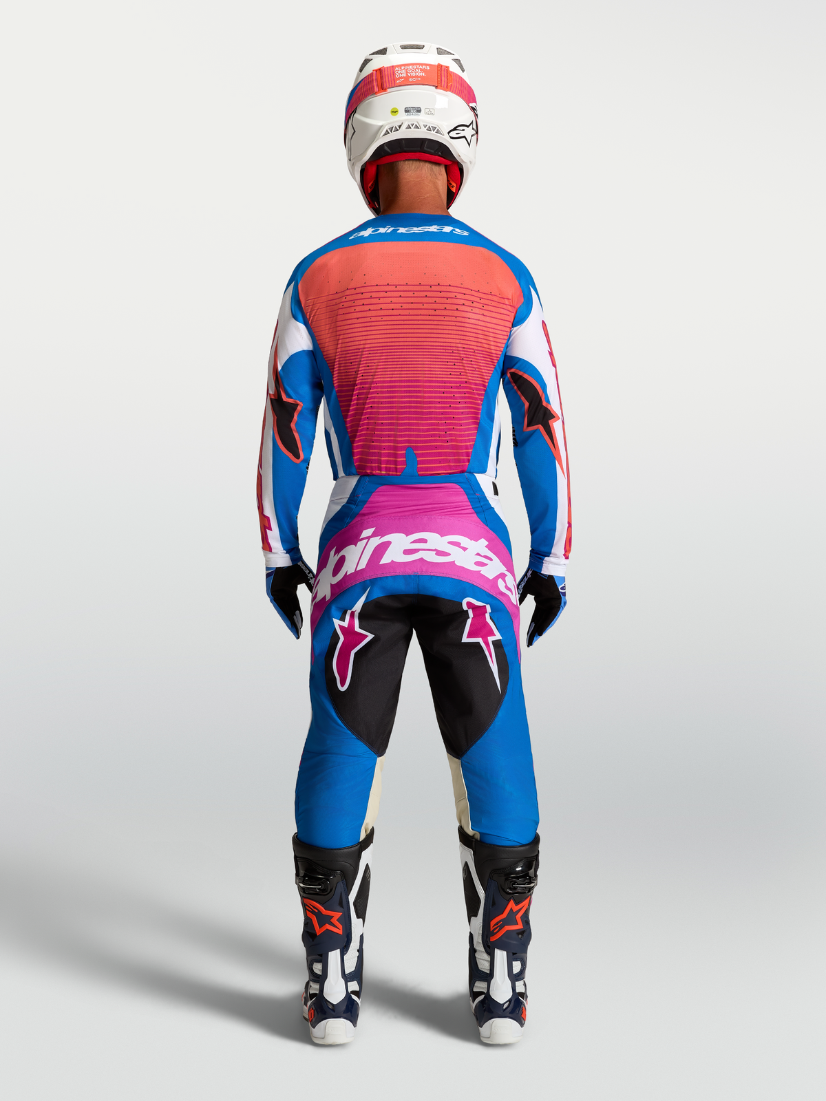 Alpinestars Techstar Maven, koszulka i zestaw, niebieski i koralowy strój motocrossowy, widok z tyłu.
