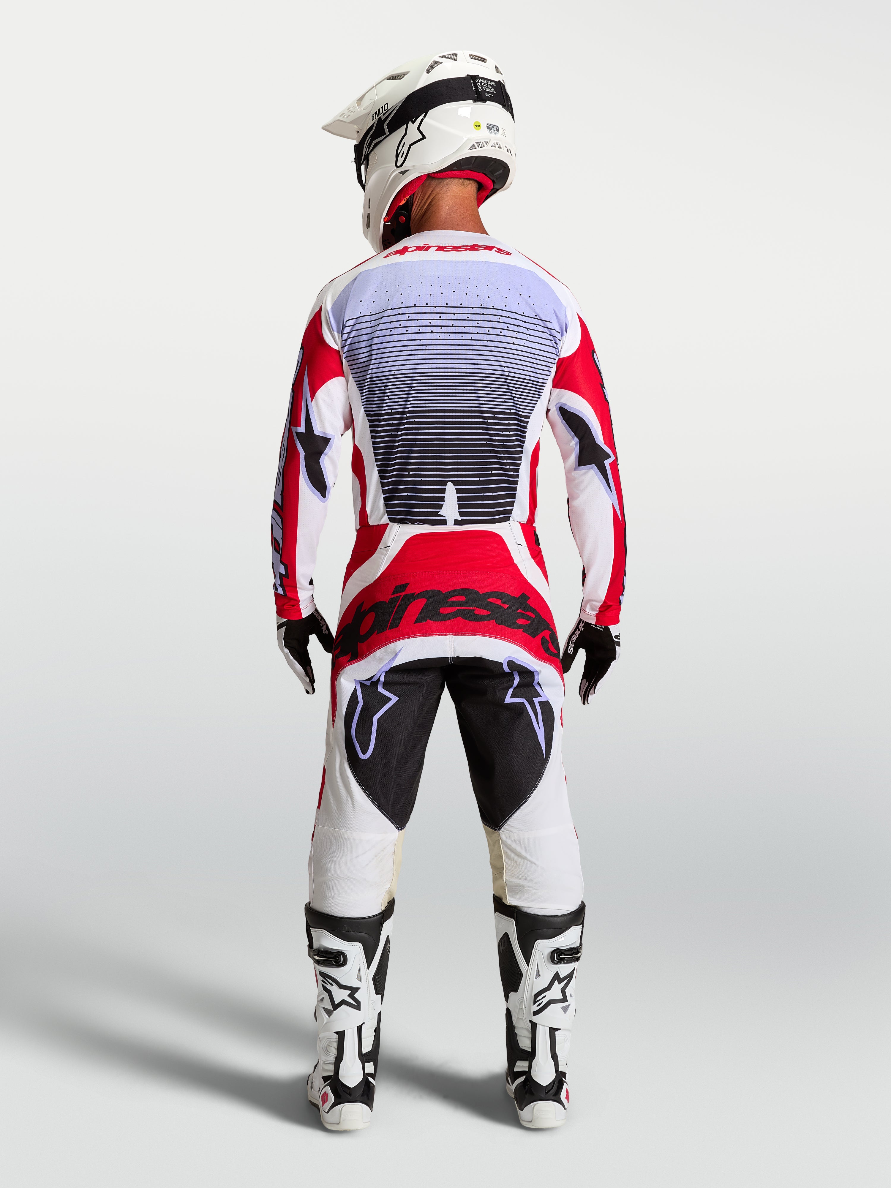 Alpinestars Techstar Maven Motocross Gear Set, Men's Fire Red and White racing jersey and pants, athletic fit, rear view.