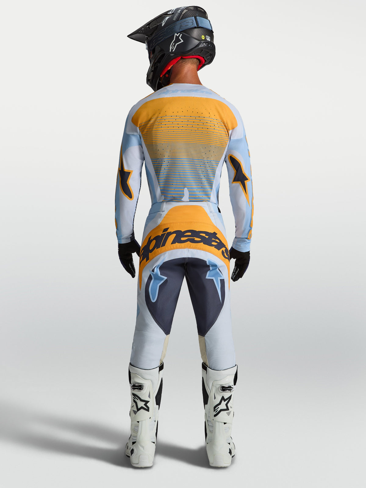 Alpinestars koszulka Techstar Maven i Techstar Maven Gear Set, męski zestaw motocross, niebieski i pomarańczowy, widok z tyłu.
