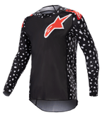 Alpinestars 2023 Supertech North Jersey, koszulka motocrossowa, czarna z neonowymi czerwonymi akcentami, długie rękawy z wzorem białych kropek, czerwono-białe logo z gwiazdą na piersi i ramionach, lekka siatka techniczna o sportowym kroju wyścigowym