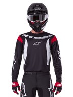 Alpinestars koszulka i zestaw Fluid Haul 2025, męski strój motocrossowy, czarno-biały z czerwonymi akcentami.