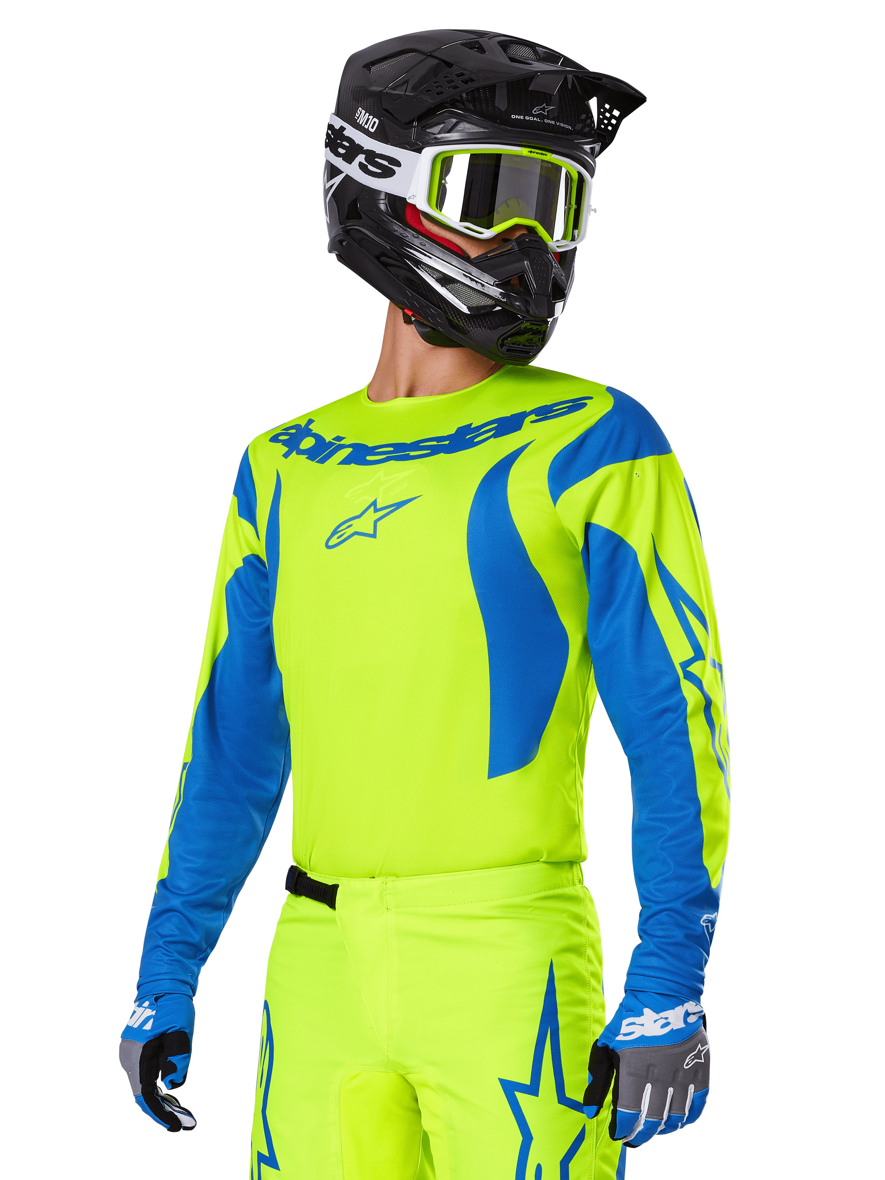 Alpinestars 2025 Fluid Haul Gear Set, koszulka i spodnie motocrossowe, jaskrawożółty i niebieski, czarny kask i gogle w żółtych oprawkach, niebieskie wzory przypominające fale na rękawach i niebieskie logo gwiazdy na spodniach, dopasowany strój do wyścigów terenowych