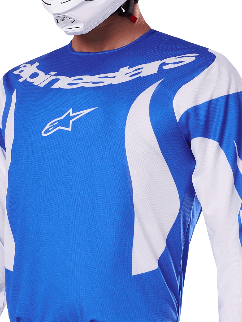 Alpinestars 2025 Fluid Haul Jersey, niebiesko-biała koszulka motocrossowa noszona przez zawodnika w białym kasku, biały napis Alpinestars i logo A-star, sportowy krój, lekki materiał odprowadzający wilgoć, do motocrossu i jazdy terenowej