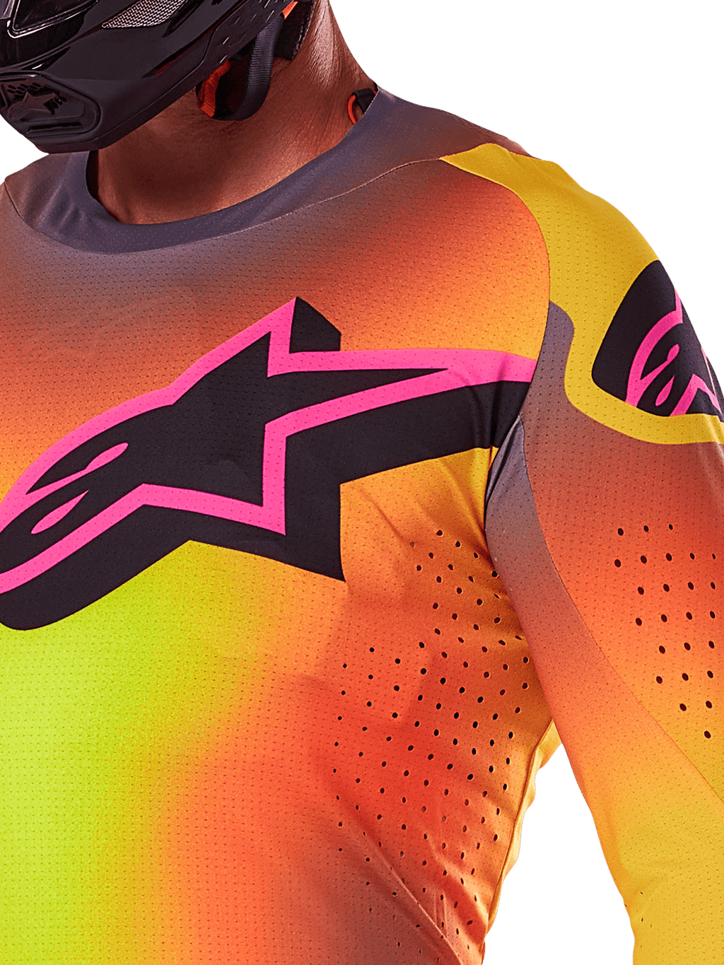 Alpinestars 2025 Supertech Lipan Jersey, zbliżenie na koszulkę motocrossową, kolor żółto-różowy z jaskrawym gradientem, duże czarne logo gwiazdy z różową obwódką na piersi, widoczne laserowo wycinane perforacje dla lepszej wentylacji