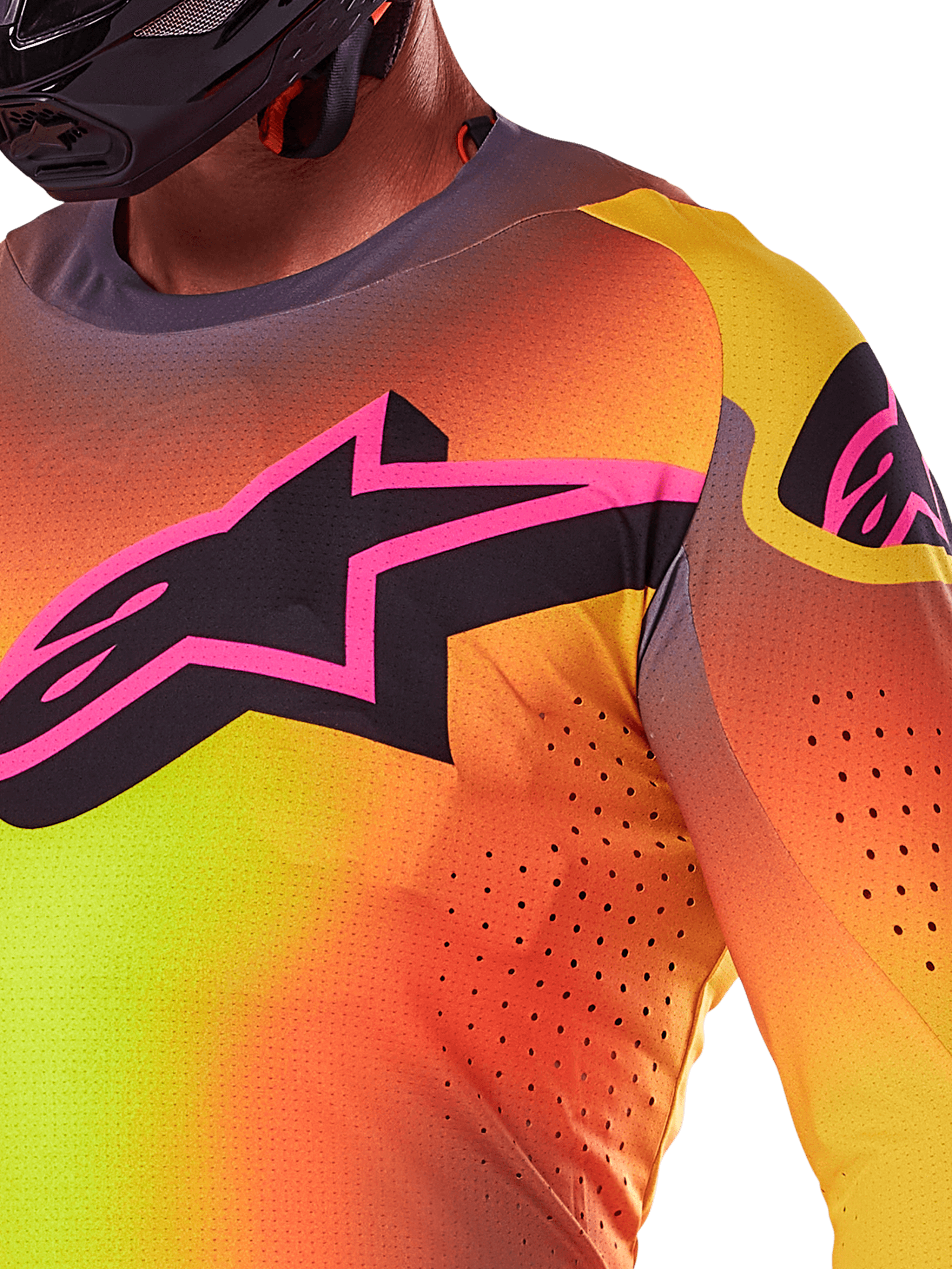 Alpinestars 2025 Supertech Lipan Jersey, zbliżenie na koszulkę motocrossową, kolor żółto-różowy z jaskrawym gradientem, duże czarne logo gwiazdy z różową obwódką na piersi, widoczne laserowo wycinane perforacje dla lepszej wentylacji