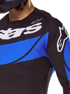 Alpinestars 2025 Techstar Dreem Jersey and Gear Set, black and blue ventilated motocross top with laser-cut perforations.