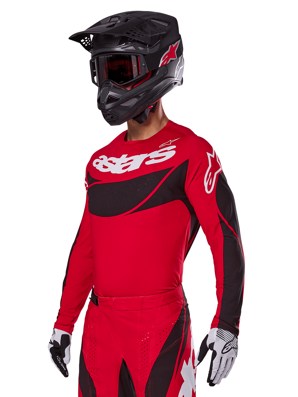 Zestaw Alpinestars 2025 Techstar Dreem, czerwona koszulka i spodnie motocrossowe z czarnymi i białymi akcentami, czarny kask i gogle, biało-czarne rękawice, z wyraźnym brandingiem „astars”, zaprojektowany do wyczynowej jazdy terenowej