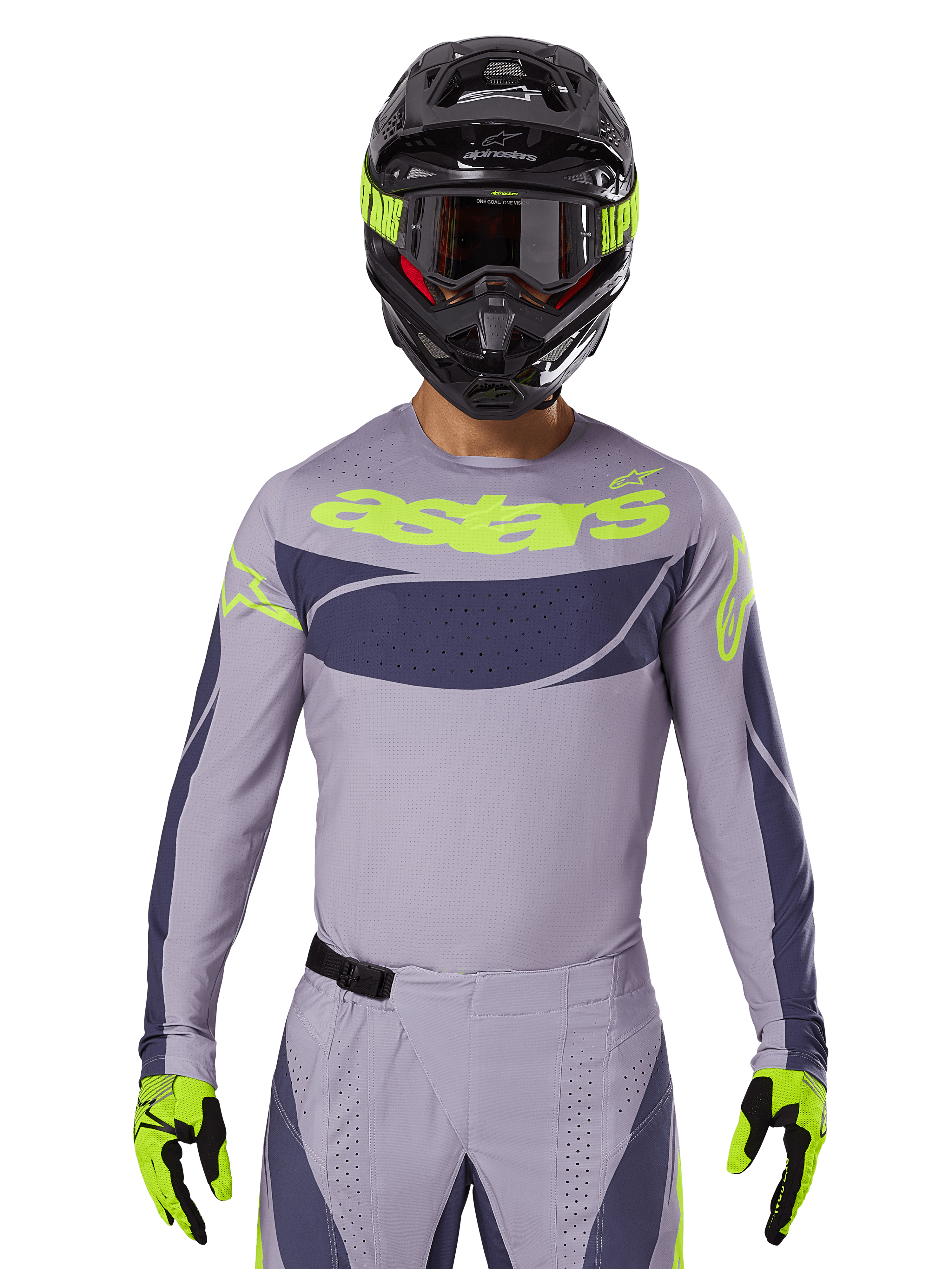 Alpinestars Techstar Dreem Jersey i zestaw odzieży 2025, strój motocrossowy, jasnoszary i ciemnoszary z neonowożółtymi akcentami, z logo „astars”, noszony z czarnym kaskiem, goglami i dopasowanymi rękawicami, techniczny perforowany materiał zapewniający wydajność w terenie