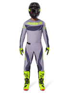 Alpinestars 2025 Techstar Dreem Gear Set, kompletny zestaw motocrossowy, szary i ciemnoszary z neonowymi żółtymi akcentami, dopasowana koszulka i spodnie, neonowe żółte buty, czarny kask, profesjonalny strój do wyścigów terenowych