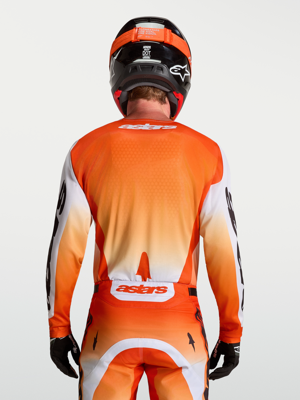 Alpinestars koszulka Racer Amber, męska koszulka motocrossowa, pomarańczowa i biała, widok z tyłu na sportowy krój