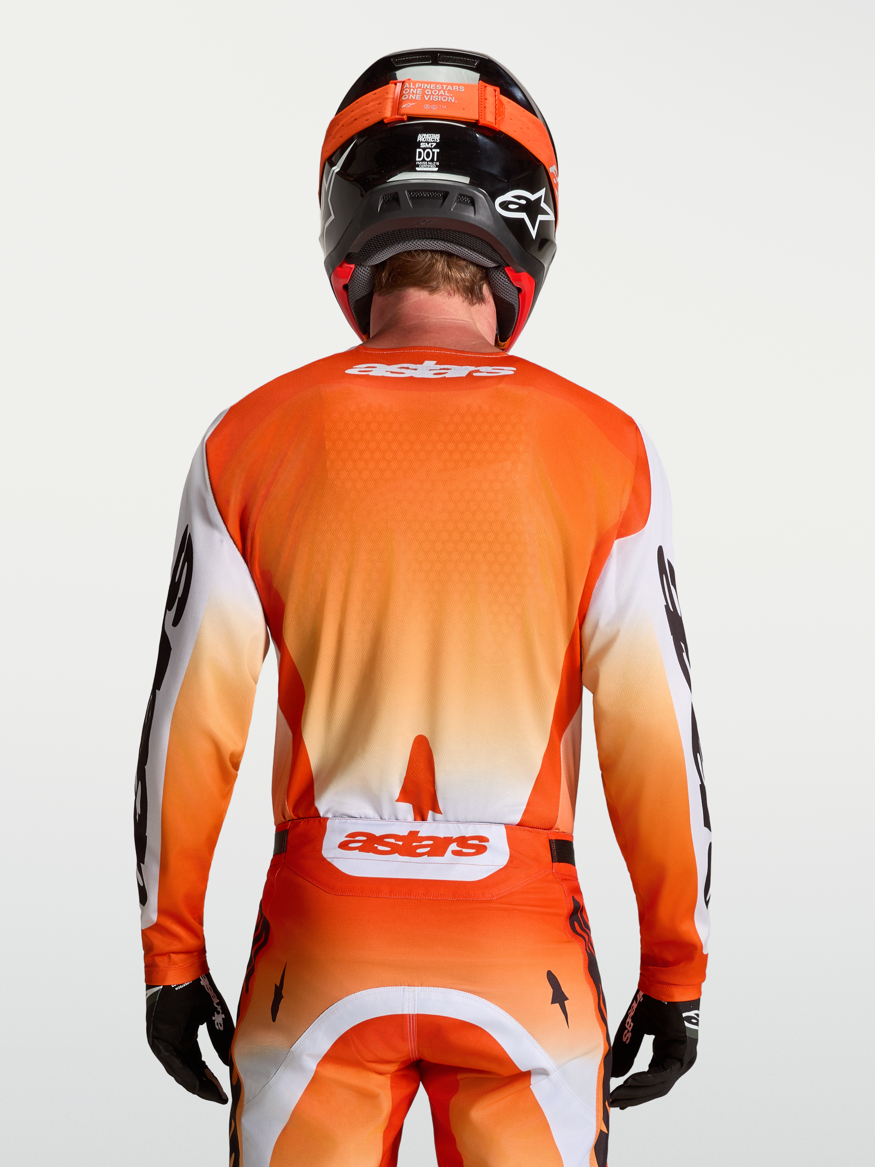 Alpinestars koszulka Racer Amber, męska koszulka motocrossowa, pomarańczowa i biała, widok z tyłu na sportowy krój