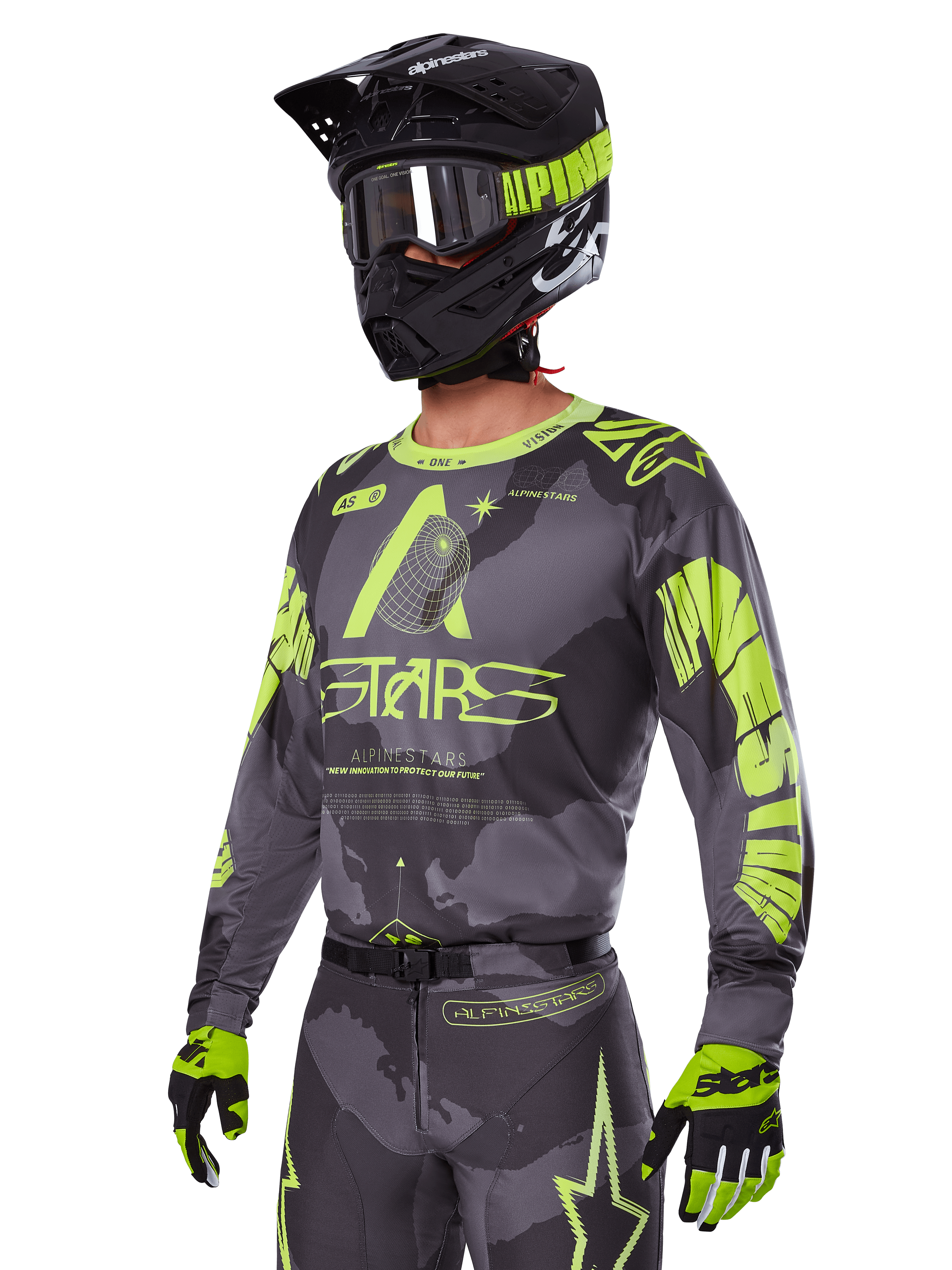 Zestaw Racer Hollow 2025 Alpinestars, koszulka i spodnie motocrossowe w kolorze szarym i neonowym żółtym, zestawiony z czarnym kaskiem, goglami i rękawicami, wyrazisty fluorescencyjny żółty branding Alpinestars i grafiki gwiazd na wzorzystym szarym tle, profesjonalny wygląd wyścigowy off-road