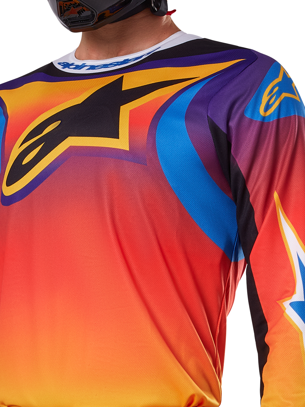 Alpinestars 2025 Fluid Wurx Jersey, wielokolorowy biało-pomarańczowy design, koszulka motocrossowa z długim rękawem, swobodny krój sportowy, odprowadzająca wilgoć polifabryka zapewniająca wydajność w terenie