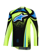 Alpinestars Techstar Nomur Jersey 2026, koszulka motocrossowa, żółta neonowa i czarna z niebieskimi akcentami, duże niebiesko-białe logo Astar na klatce piersiowej, detale graficzne typu splatter, długi rękaw, sportowa odzież do wyścigów terenowych