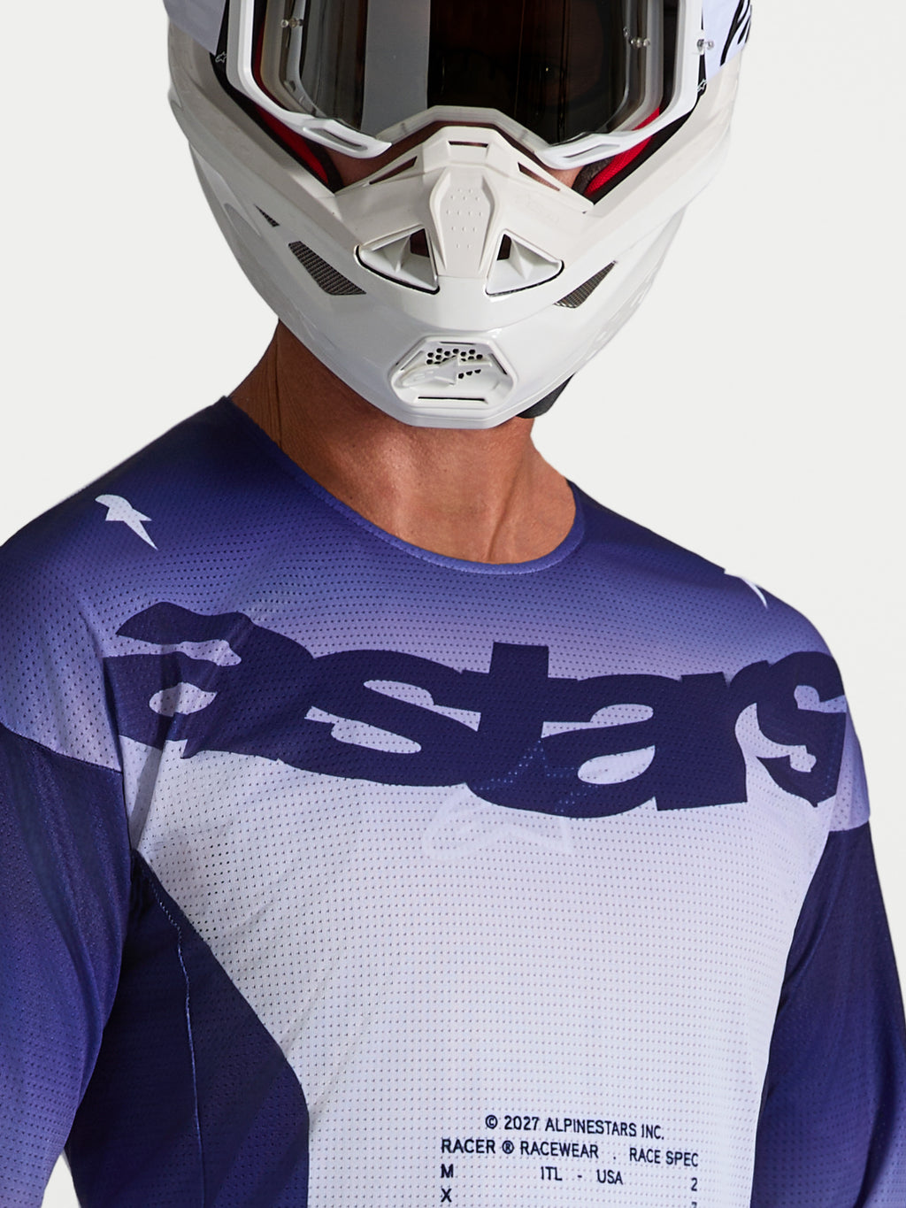 Alpinestars koszulka Racer Air Amber, niebieska i biała, siatkowa koszulka motocrossowa z logo Astars, ujęcie na modelu.