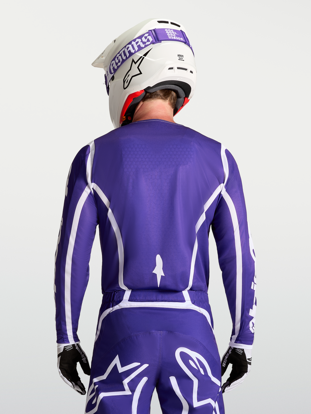 Koszulka Fluid Apex V2, męska odzież motocrossowa Alpinestars, granatowa i biała, widok z tyłu z pasującymi spodniami