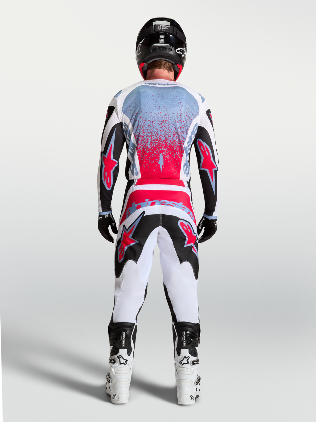 Alpinestars Fluid Drag Jersey, Men's Motocross Racing Jersey in Black and Red Fluo, shown from a rear view on a rider.