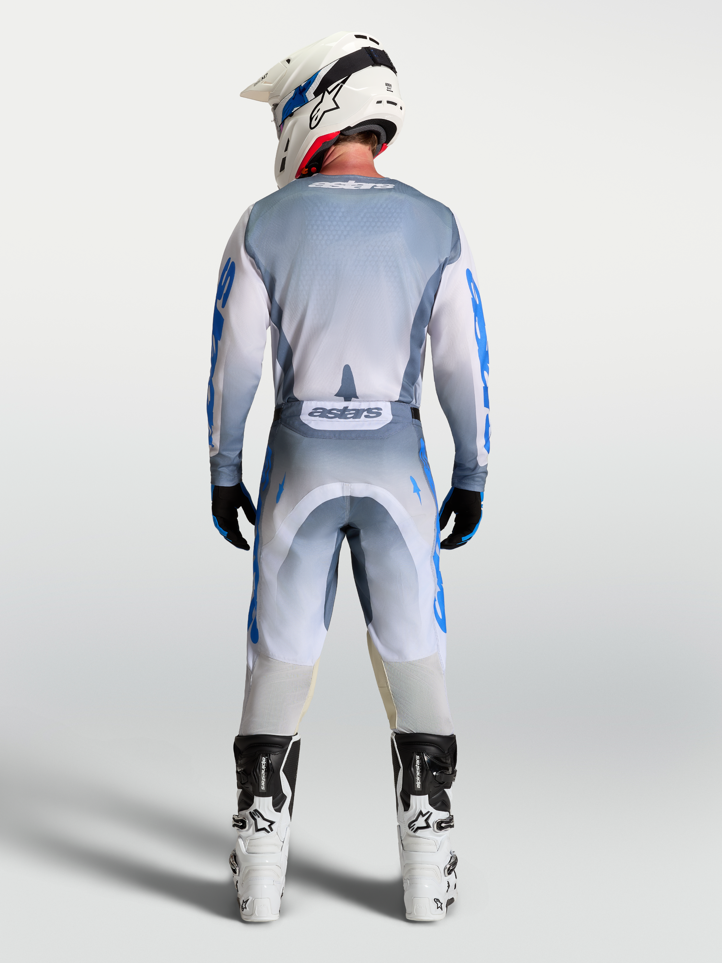 Alpinestars Racer Amber Pants, Men's Motocross Gear in Ash Gray and UCLA Blue, shown from the back in a full outfit.