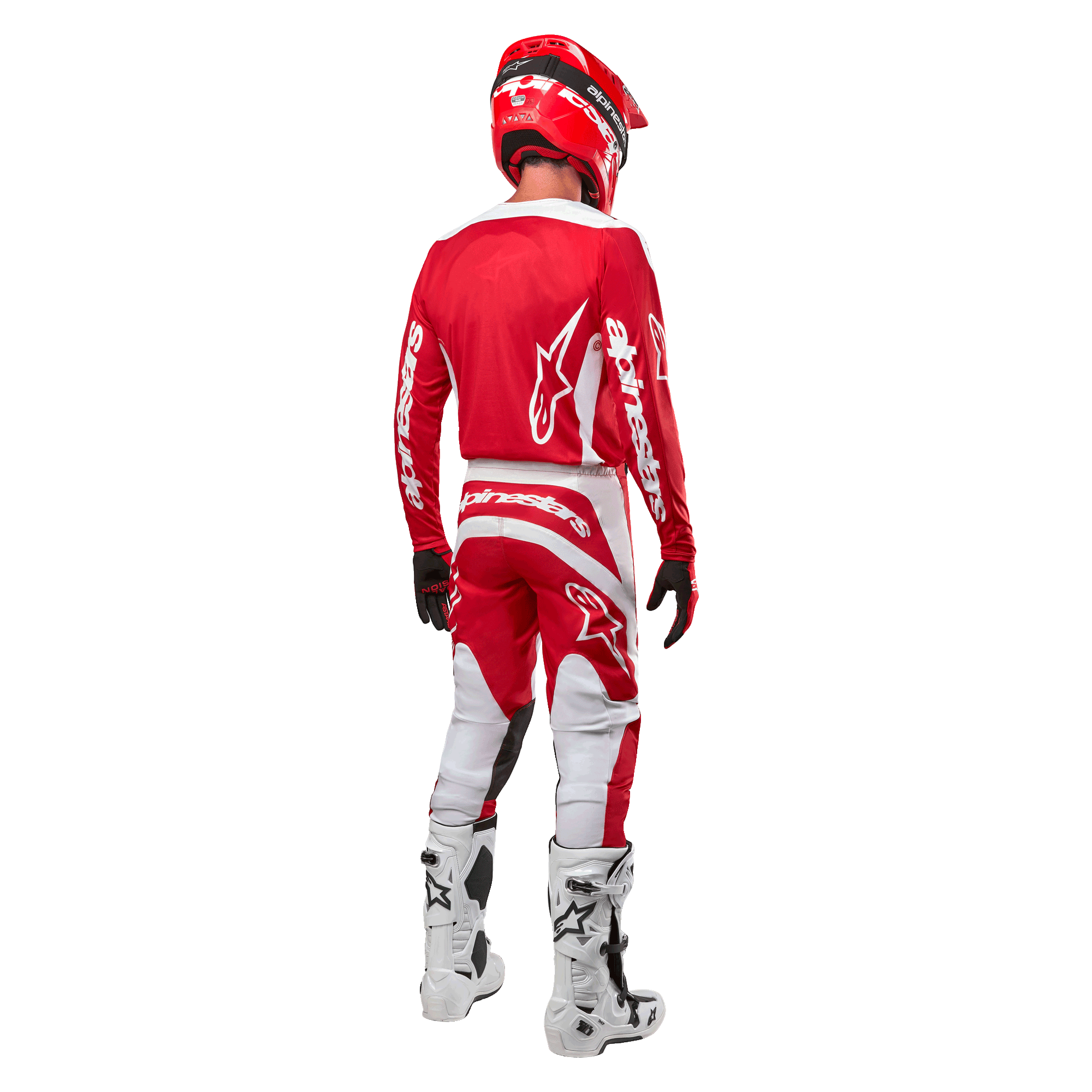 Widok od tyłu zawodnika motocrossowego ubranego w koszulkę Alpinestars 2024 Fluid Lurv w kolorze Mars Red White, zestawioną z dopasowanymi czerwono-białymi spodniami, białymi butami off-road i czerwonym kaskiem, prezentujący design pleców oraz logo Alpinestars.