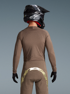 Alpinestars Koszulka Supertech Air Gold Edycja Limitowana i spodnie MX, męskie, brązowe i złote, wentylacja wycinana laserowo.