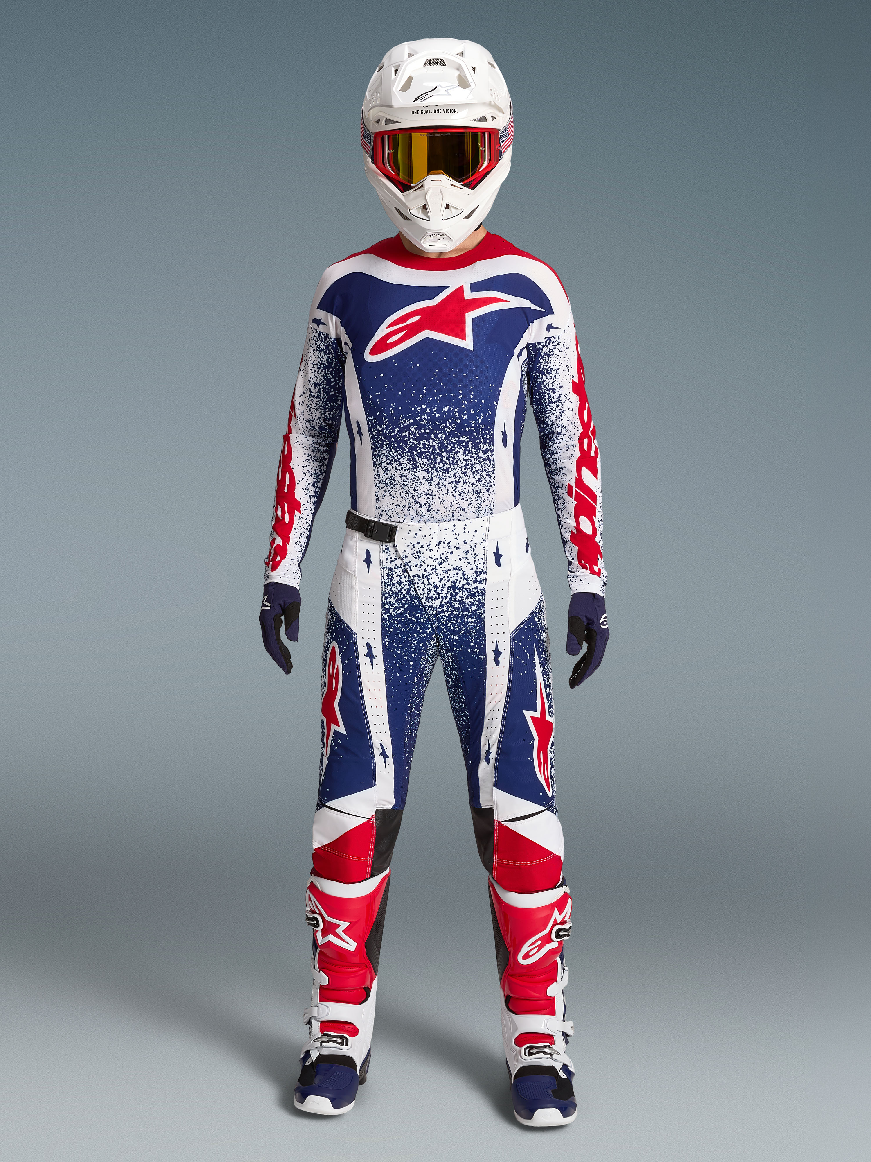 Alpinestars Techstar Unity, czerwono-biało-niebieski zestaw motocrossowy z grafiką gwiazd, wyścigowa odzież off-road.