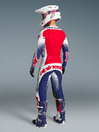Alpinestars zestaw Techstar Unity edycja limitowana, męski komplet motocrossowy, biały, czerwony i niebieski, widok z tyłu.