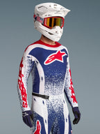 Koszulka Alpinestars Techstar Unity Limited Edition, czerwono-niebieski wzór splatter, męski model do wyścigów motocross.