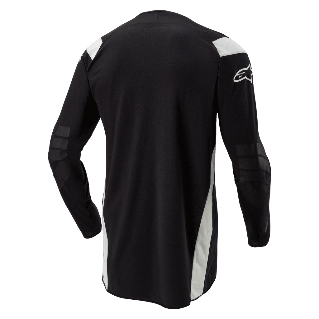 Koszulka Alpinestars Techdura, koszulka enduro motocross, czarna z białymi akcentami, widok z tyłu z przedłużonym tyłem, wzmocnionymi łokciami i białym logo Alpinestars na rękawie, wytrzymała odzież do jazdy terenowej