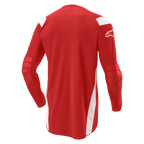 Alpinestars Techdura Jersey, koszulka motocrossowa i enduro, jasnoczerwona z białymi panelami, widok z tyłu pokazujący wydłużony tył i wzmocnione łokcie, białe logo Alpinestars na rękawie, wytrzymała odzież terenowa
