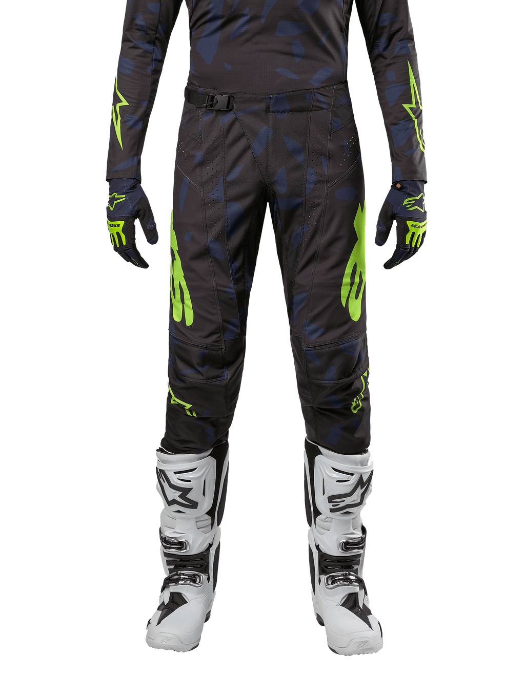 Alpinestars Techstar Rantera Pants 2024, spodnie motocrossowe, czarno-granatowe z jaskrawym żółtym (Yellow Fluo), noszone z pasującą koszulką z długim rękawem, rękawicami i białymi butami motocrossowymi, z wyraźnymi neonowożółtymi akcentami i abstrakcyjnym ciemnym wzorem.