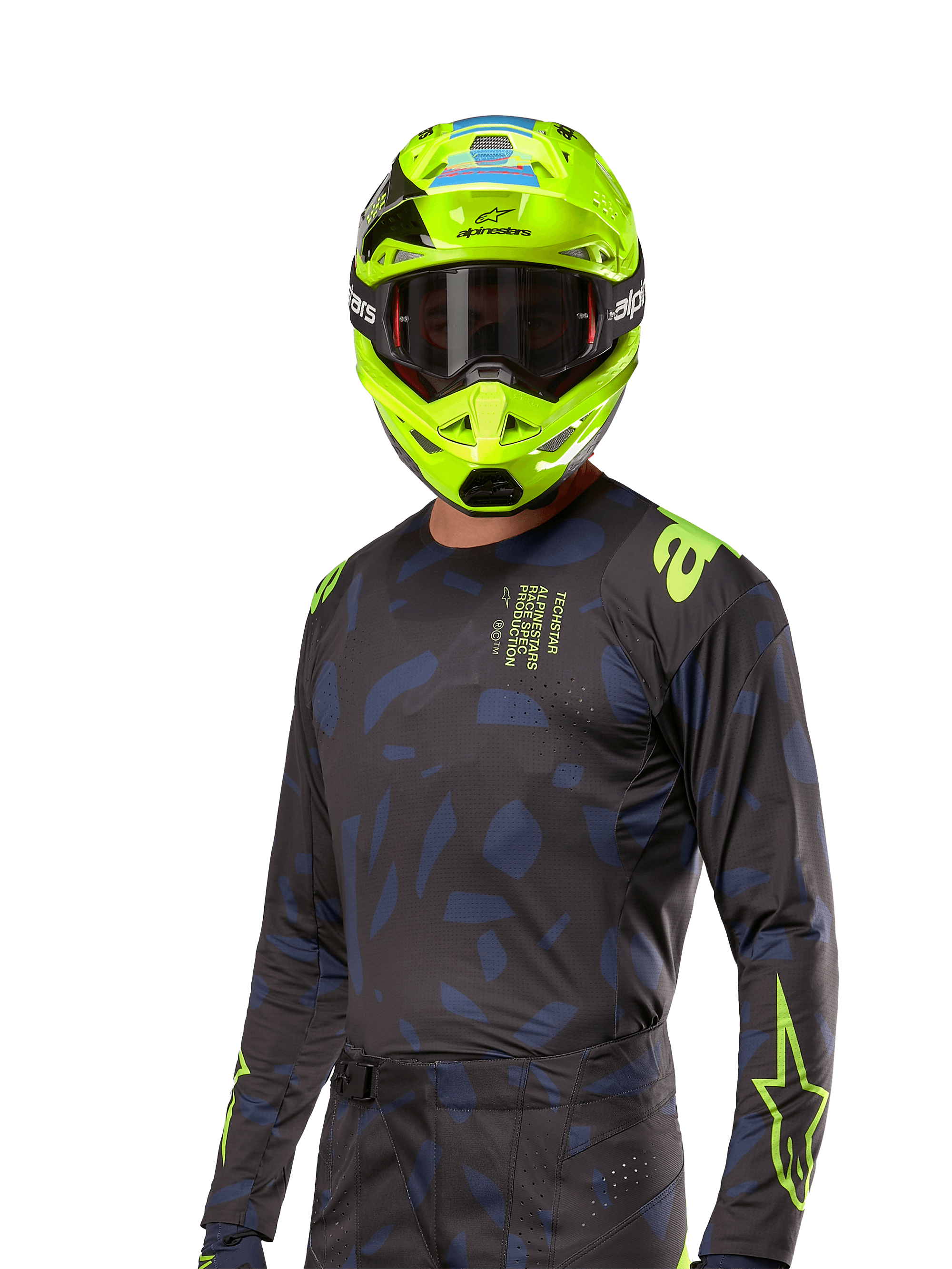 Koszulka Alpinestars Techstar Rantera 2024, koszulka motocrossowa, czarno-granatowa z abstrakcyjnymi wzorami i neonowożółtymi akcentami, noszona z pasującym neonowożółtym kaskiem, sportowy krój do jazdy terenowej
