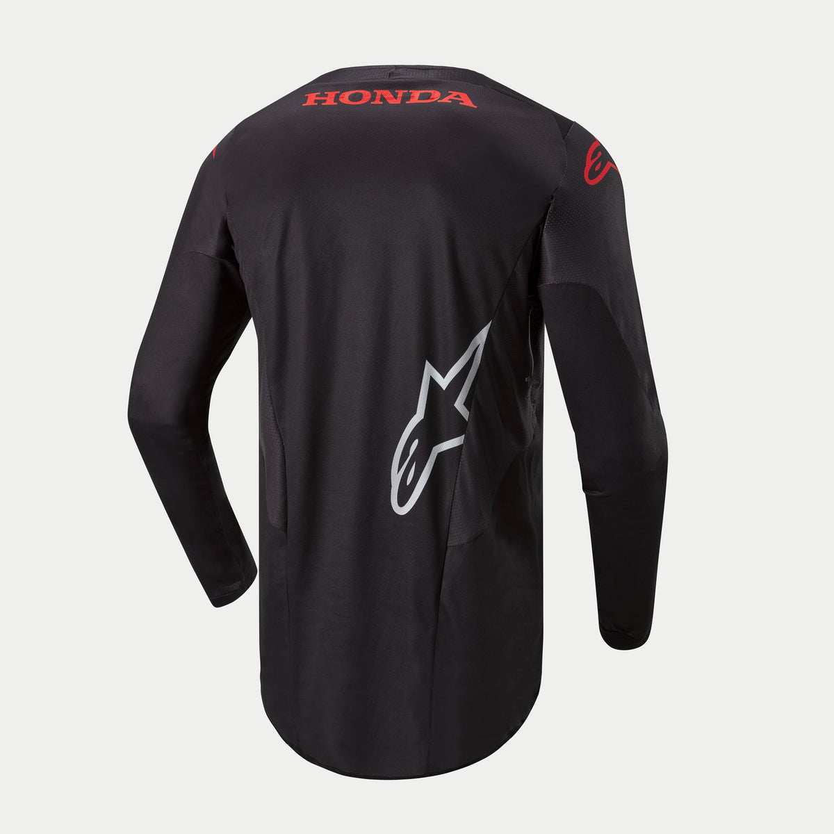 Alpinestars Koszulka Honda Racer Iconic, czarna męska koszulka motocrossowa z długim rękawem i przedłużonym tyłem, widok z tyłu przedstawiający czerwone logo Honda i białą grafikę Alpinestars
