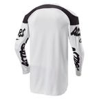 Alpinestars 2024 Racer Hana Jersey, koszulka motocrossowa, biało-czarna, widok z tyłu z przedłużonym tyłem dla lepszej osłony, czarne panele na ramionach i czarne logotypy na rękawach, wytrzymały materiał odprowadzający wilgoć