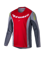 Alpinestars Youth Racer Melt Jersey 2025, koszulka motocrossowa, jaskrawoczerwona i szara, duże białe logo na piersi, neonowożółte akcenty na ramionach, techniczny materiał z długim rękawem do jazdy terenowej