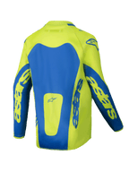 Alpinestars Youth Racer Veil Jersey 2025, młodzieżowa koszulka motocrossowa, żółty neonowy i niebieski, widok z tyłu z wyraźnymi niebieskimi panelami i brandingiem astars na rękawach, przedłużony tył zapewniający osłonę, lekki materiał odprowadzający wilgoć do jazdy terenowej