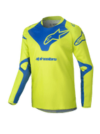 Alpinestars Youth Racer Veil Jersey 2025, koszulka motocrossowa, żółta neonowa i niebieska, techniczna góra z długim rękawem, niebieskie logo Alpinestars na piersi i ramionach, lekka tkanina odprowadzająca wilgoć do jazdy terenowej