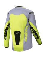 Alpinestars Youth Racer Veil Jersey 2025, młodzieżowa koszulka motocrossowa, widok z tyłu, szary i neonowy żółty, duży żółty panel na plecach, branding Astars na rękawach, czarna naszywka z logo u dołu, lekka odzież do jazdy terenowej