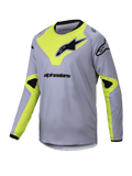Alpinestars Youth Racer Veil Jersey 2025, młodzieżowa koszulka motocrossowa z długim rękawem, szara i żółta neonowa, czarne logotypy, lekki oddychający materiał, czarny kołnierz i mankiety, geometryczny wzór