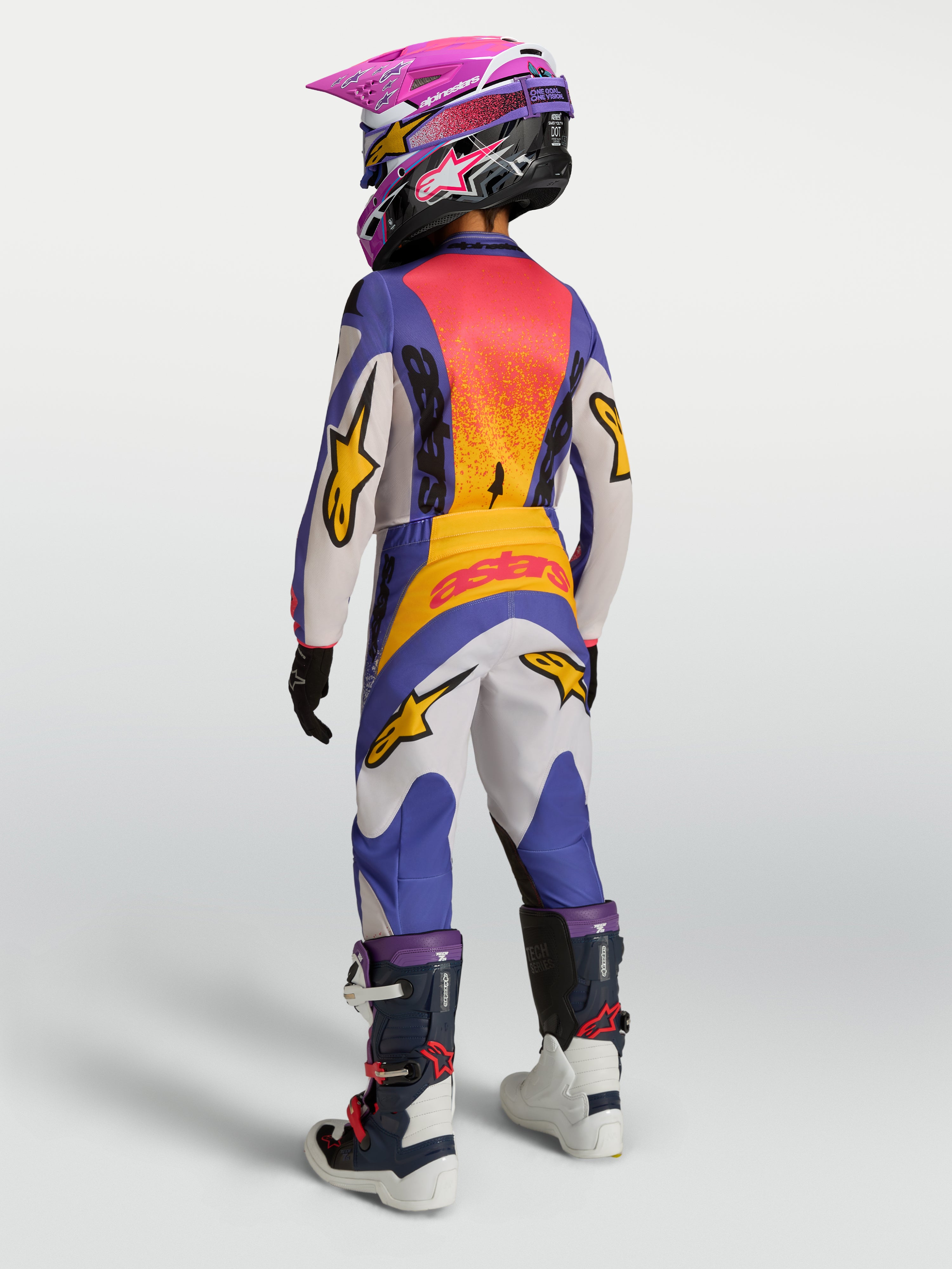 Alpinestars 2027 Youth Fluid Drag Jersey, Blue and Gold youth motocross jersey with extended rear coverage for off-road use.