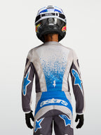 Alpinestars Koszulka Fluid Drag Młodzieżowe, szaro-niebieska koszulka motocrossowa z oddychającej tkaniny, widok z tyłu.