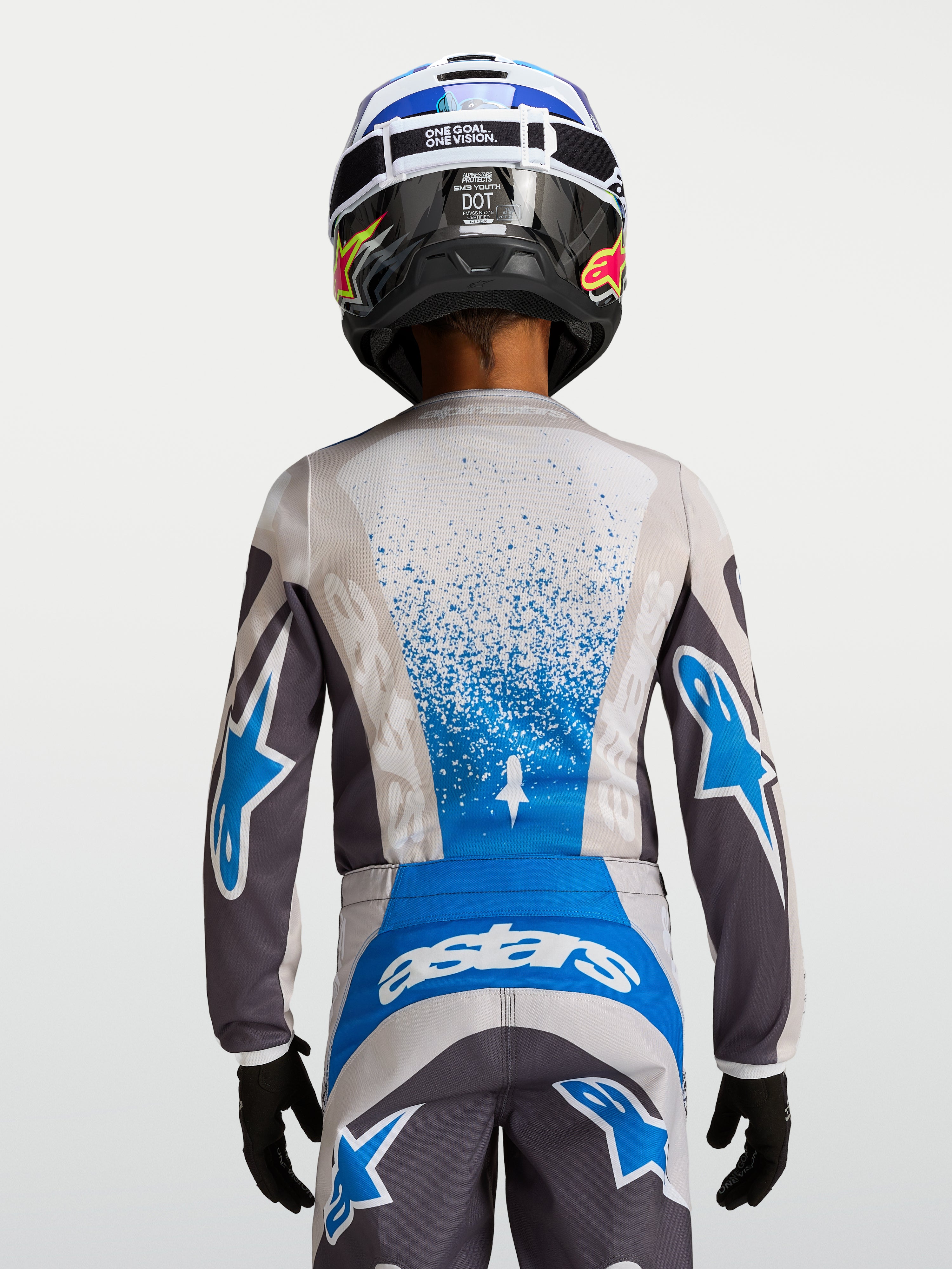 Alpinestars Koszulka Fluid Drag Młodzieżowe, szaro-niebieska koszulka motocrossowa z oddychającej tkaniny, widok z tyłu.