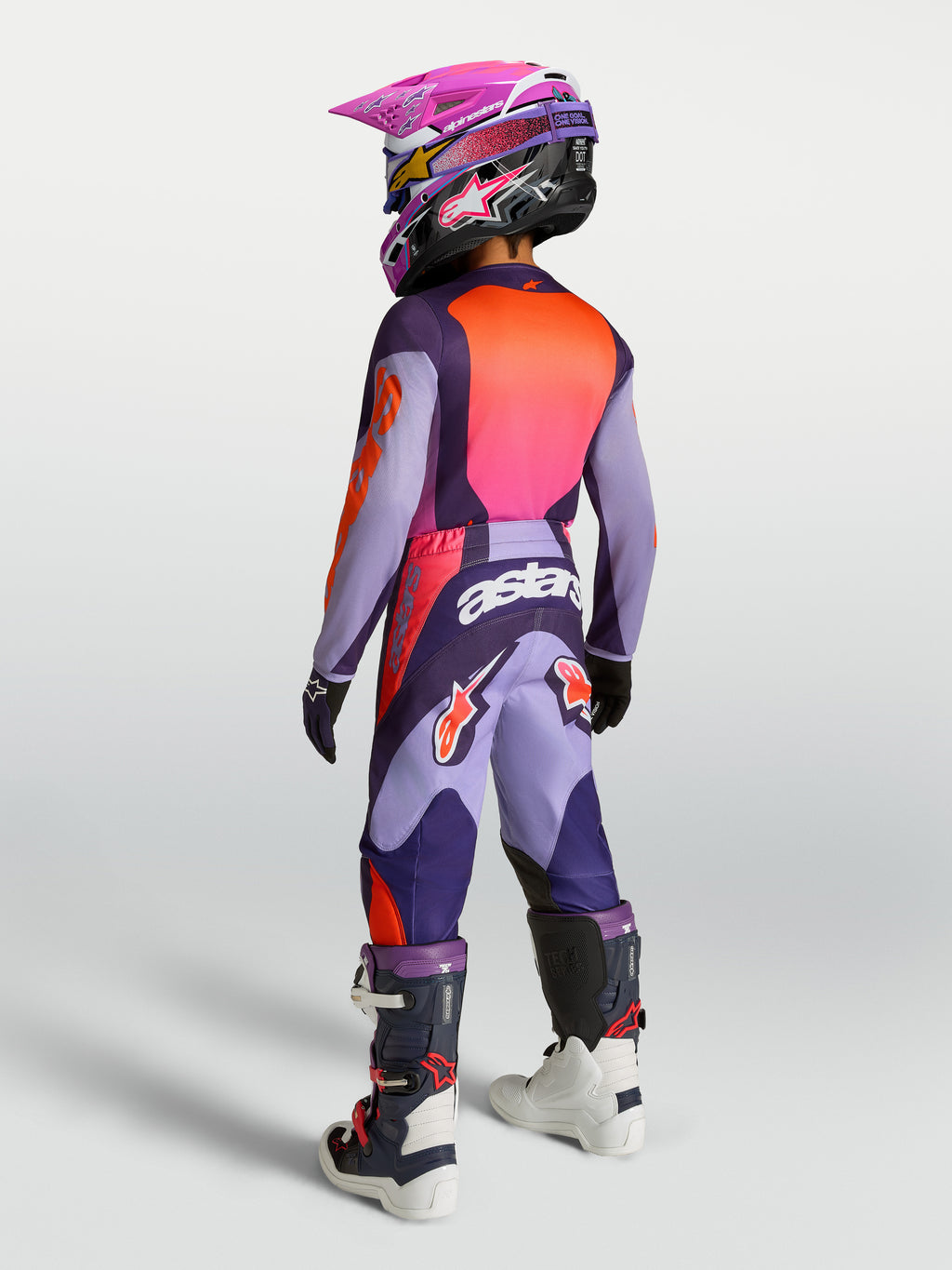 Alpinestars Fluid Hunt młodzieżowe 2027, koszulka i zestaw, fioletowy i różowy fluo, widok z tyłu na ubiór do motocrossu.