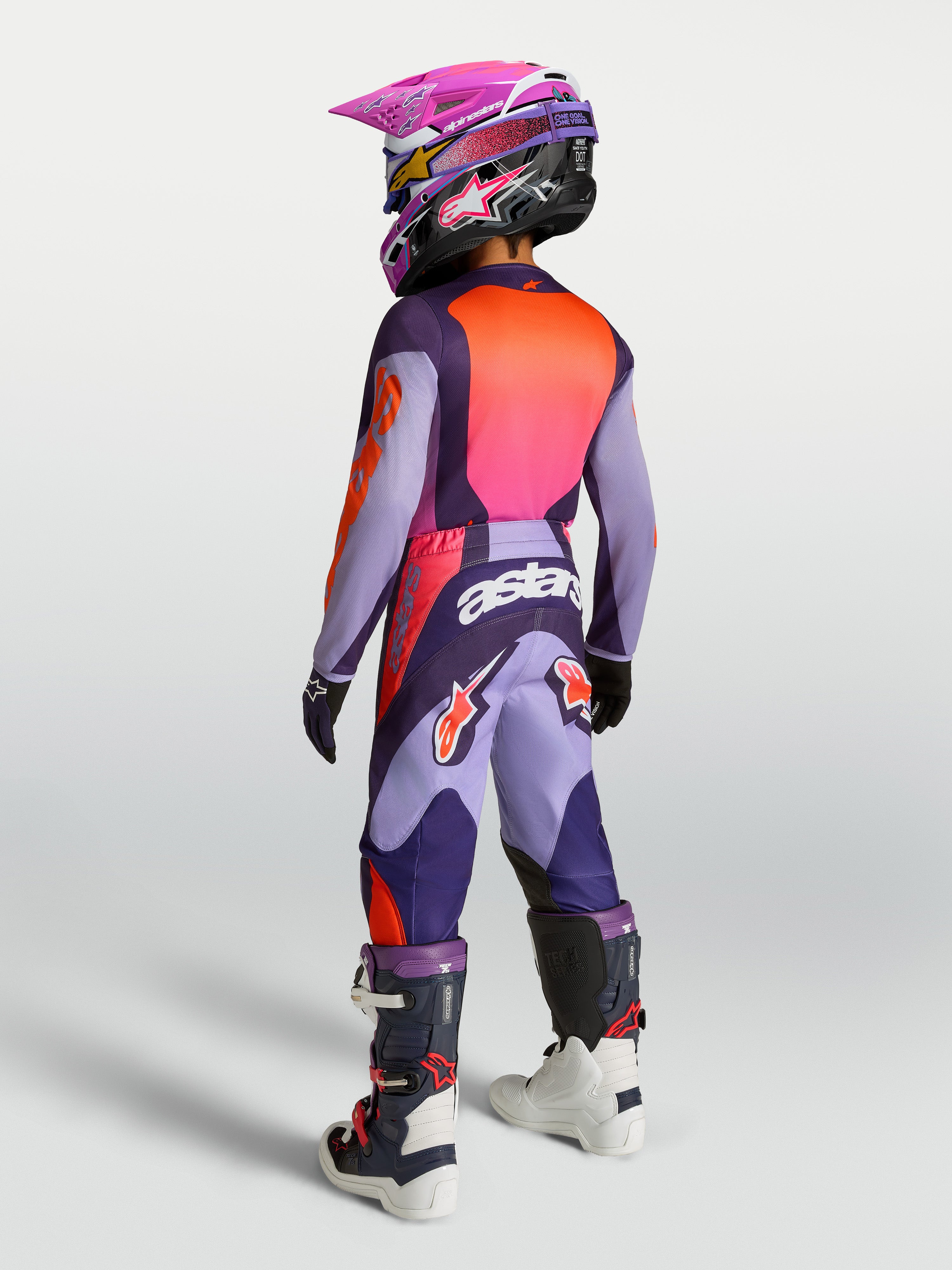 Alpinestars Fluid Hunt młodzieżowe 2027, koszulka i zestaw, fioletowy i różowy fluo, widok z tyłu na ubiór do motocrossu.