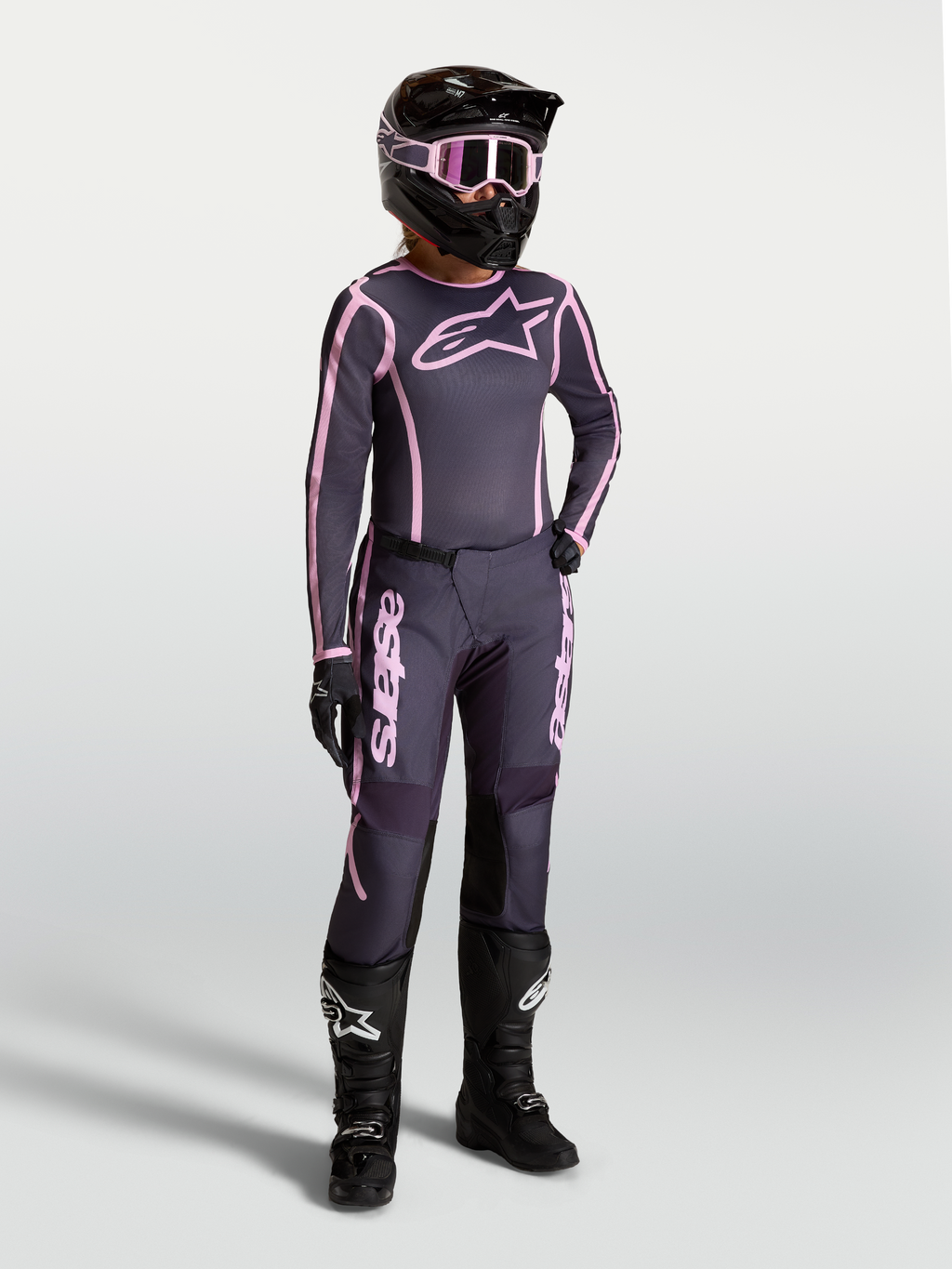 Alpinestars Stella Fluid Apex V2, damskie spodnie i koszulka motocrossowe, szare i różowe, profesjonalna odzież off-road.