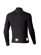 Alpinestars ZX Evo V3 Long Sleeve Top, czarna samochodowa warstwa bazowa, widok z tyłu z małym szarym logo na karku i białymi etykietami certyfikacyjnymi FIA/SFI przy dolnej krawędzi, lekka ognioodporna konstrukcja