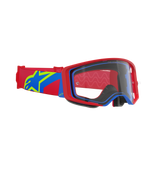 Gogle Alpinestars Supertech Corp, gogle motocrossowe, czerwono-niebieska oprawka z przezroczystą szybką, czerwono-niebieski pasek z dużym żółto-niebieskim logo gwiazdy, profesjonalna ochrona oczu do wyścigów off-road