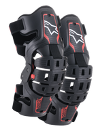 Alpinestars Youth Bionic 5S Knee Braces, ochraniacze kolan do motocrossu, czarno-czerwone, para ochraniaczy o hybrydowej konstrukcji ramy z wentylowanymi skorupami, białe logo Astar w górnej części, czerwony napis ASTARS w dolnej części oraz regulowane czarne paski zapewniające stabilne dopasowanie.